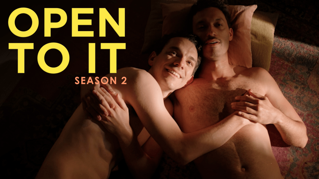 Open to It Season 2 promotional image featuring Cam and Greg embracing while exploring love, relationships and life as a throuple