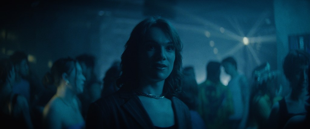 Zav at a nightclub in FEM Season 2, streaming exclusively on Dekkoo.