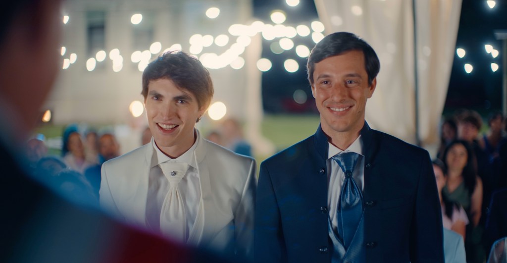 Omero and his boyfriend at a wedding in Accidental Friends, the Italian gay comedy streaming on Dekkoo
