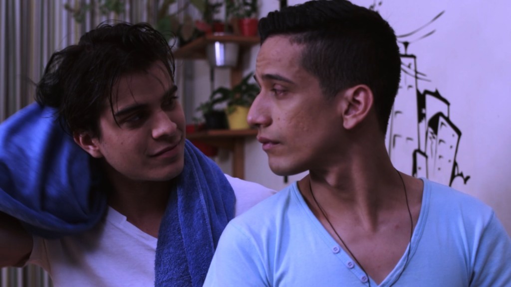 Romeu and Rômulo share a quiet, affectionate moment at home in Romeu & Romeu, the Dekkoo Exclusive Brazilian LGBTQ+ romance series.