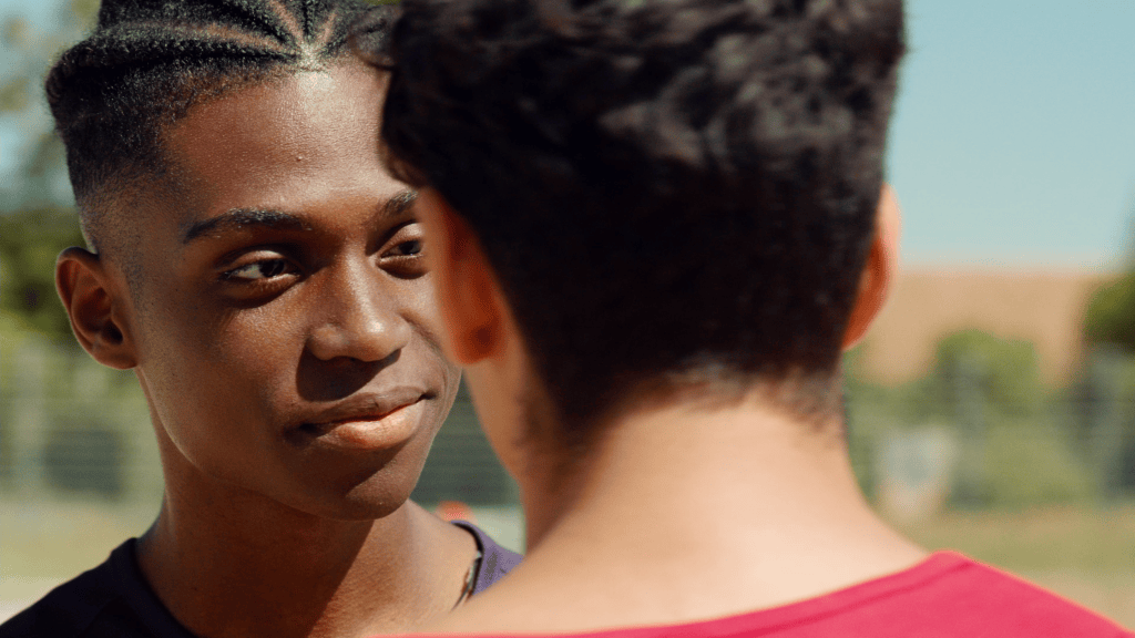 Youssou looks at Malek in the gay romance film Youssou & Malek