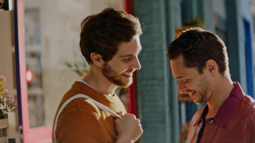 Two men sharing a warm romantic moment in Perfect Endings, a gay romance streaming on Dekkoo.