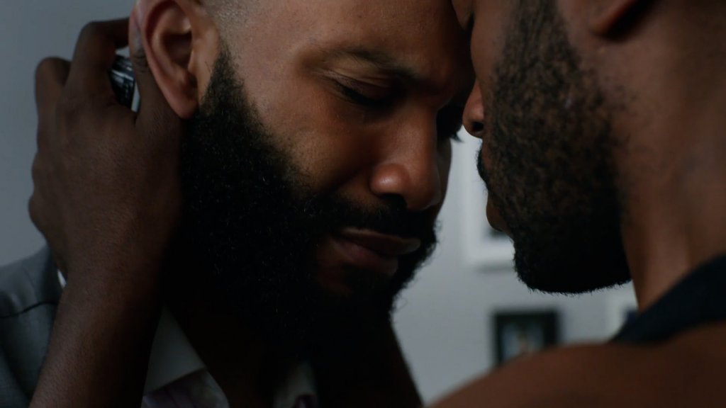 Emotional scene between a gay couple in Nana's Boys, streaming on Dekkoo