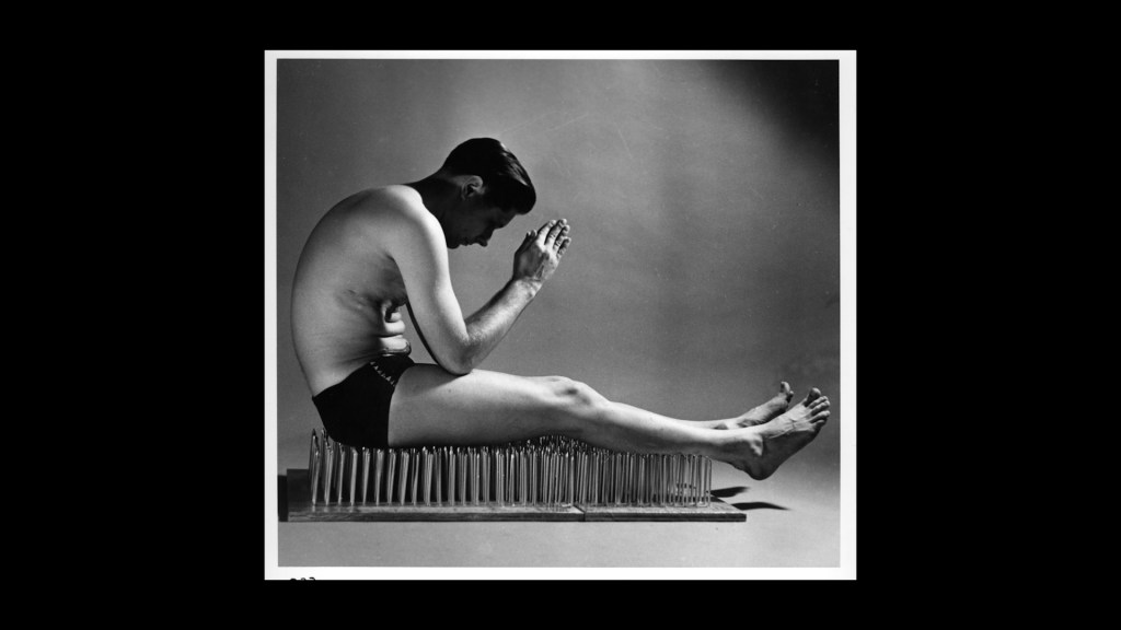 Fakir Musafar sitting on a bed of nails in A Body to Live In