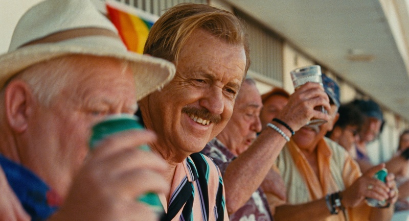 Vicente enjoying life with friends in Maspalomas, the gay drama streaming exclusively on Dekkoo