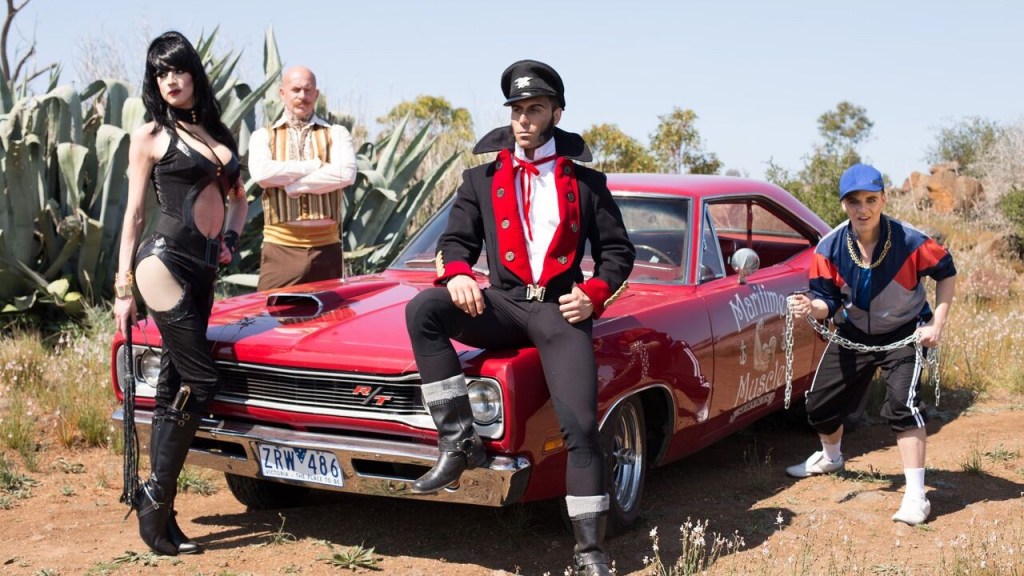 The Cockslinger and his eccentric companions on an Australian road trip in the gay comedy The Cockslinger, now streaming on Dekkoo.