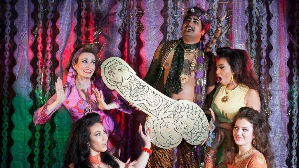Colorful burlesque performers in The Cockslinger, the camp Australian queer comedy now streaming on Dekkoo.