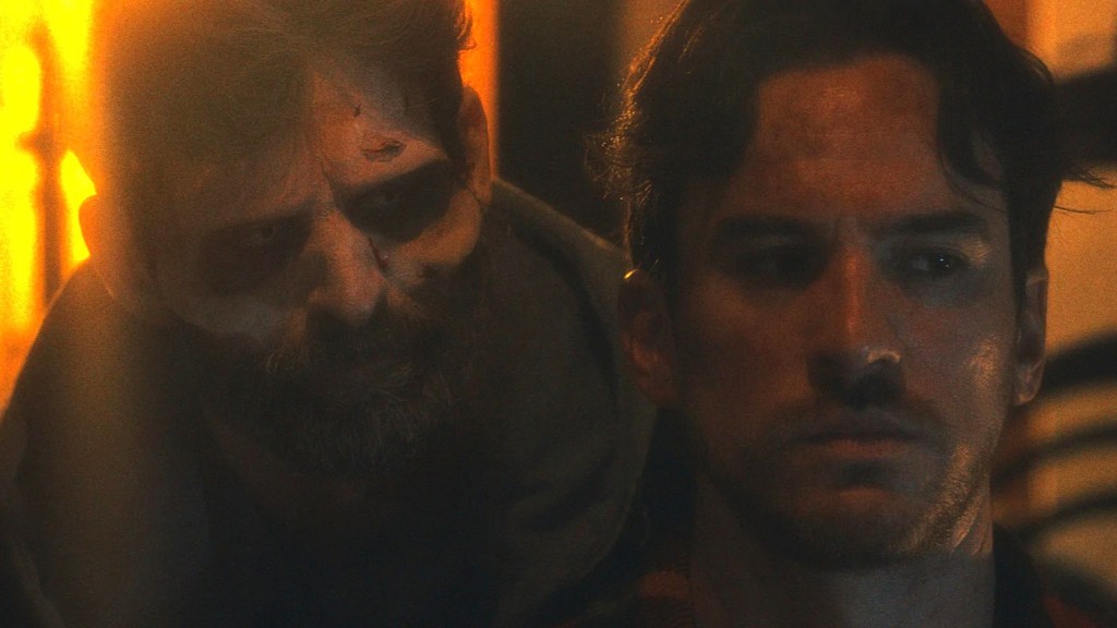 Two men in a tense scene from the gay thriller Scorch Marks